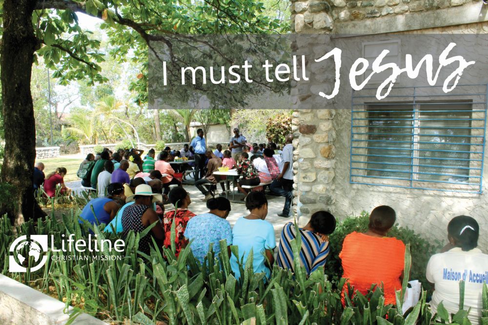 Haitian Staff Praying and Singing
